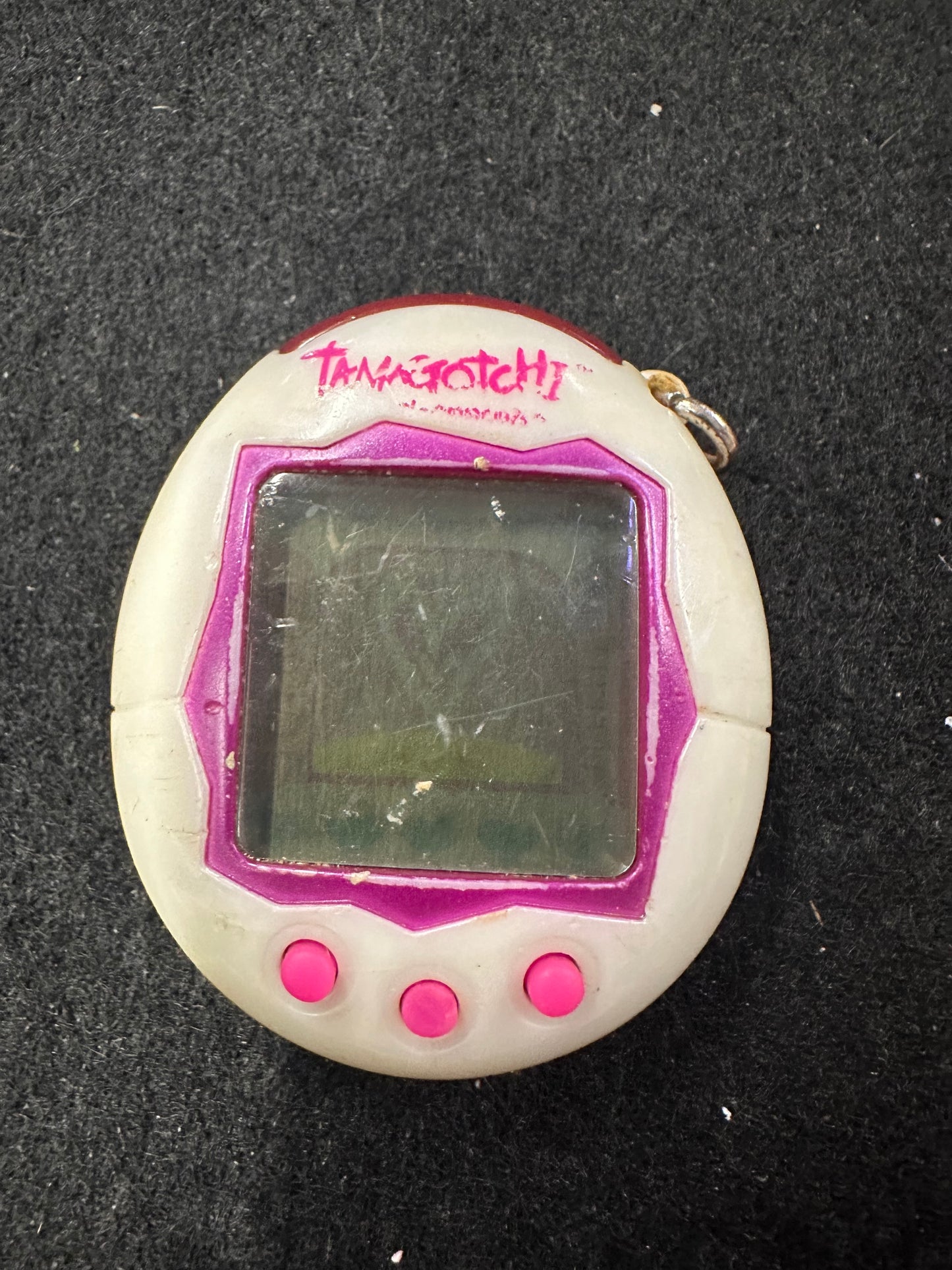 TAMAGOTCHI WHITE AND PURPLE