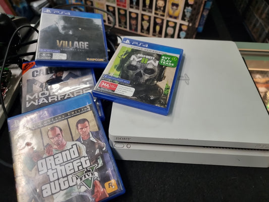 PS4 CONSOLE + 4 GAMES (NO CONTROLLER)