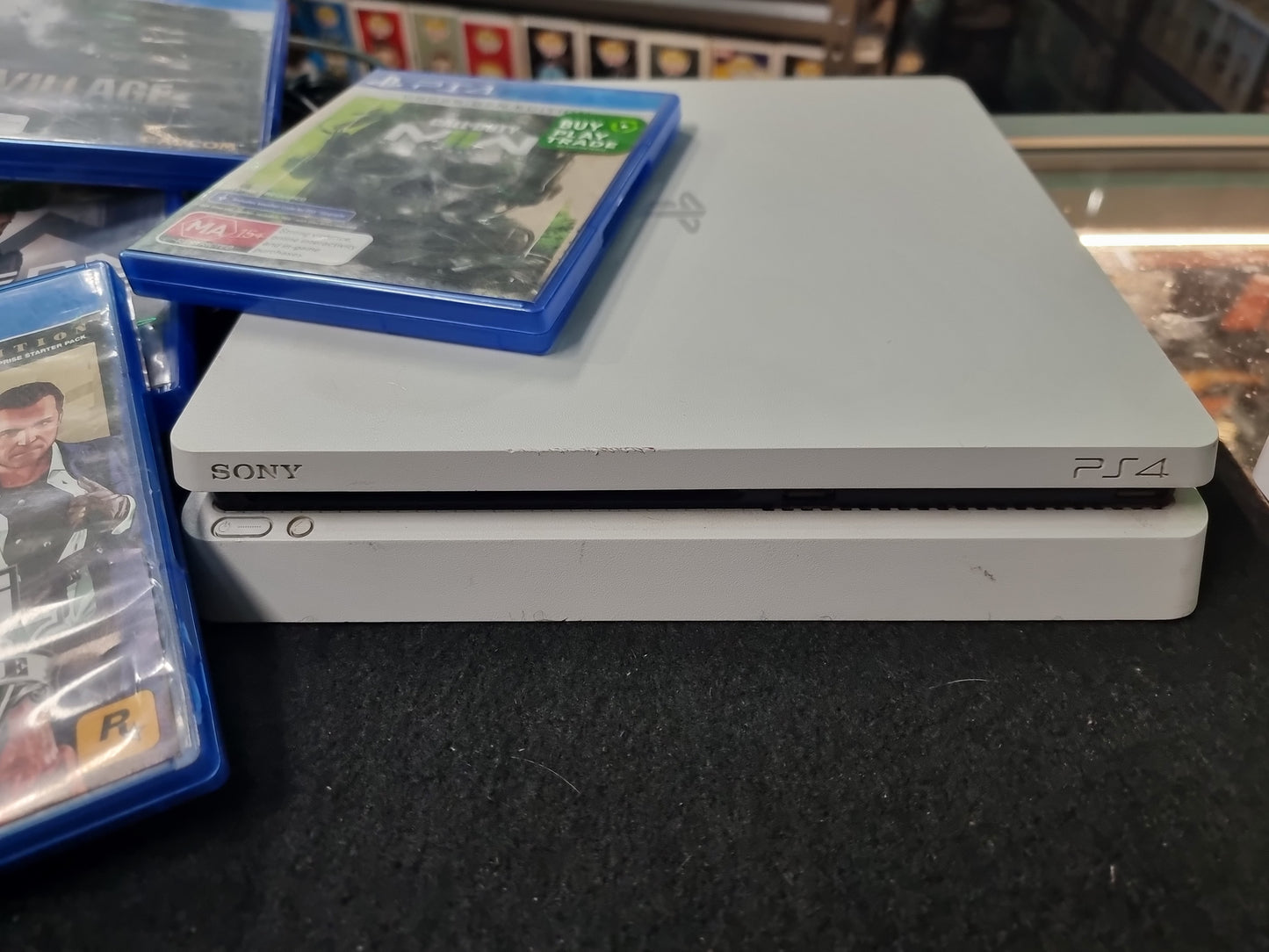 PS4 CONSOLE + 4 GAMES (NO CONTROLLER)