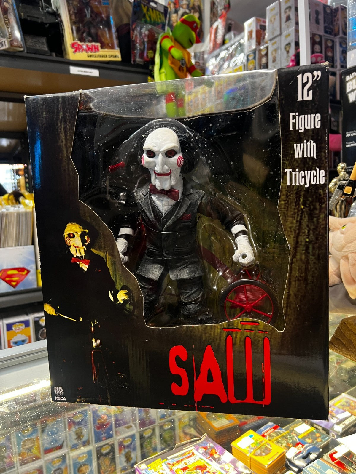 Saw 12 inch Action Figure - Riding Tricycle With Sound - NECA