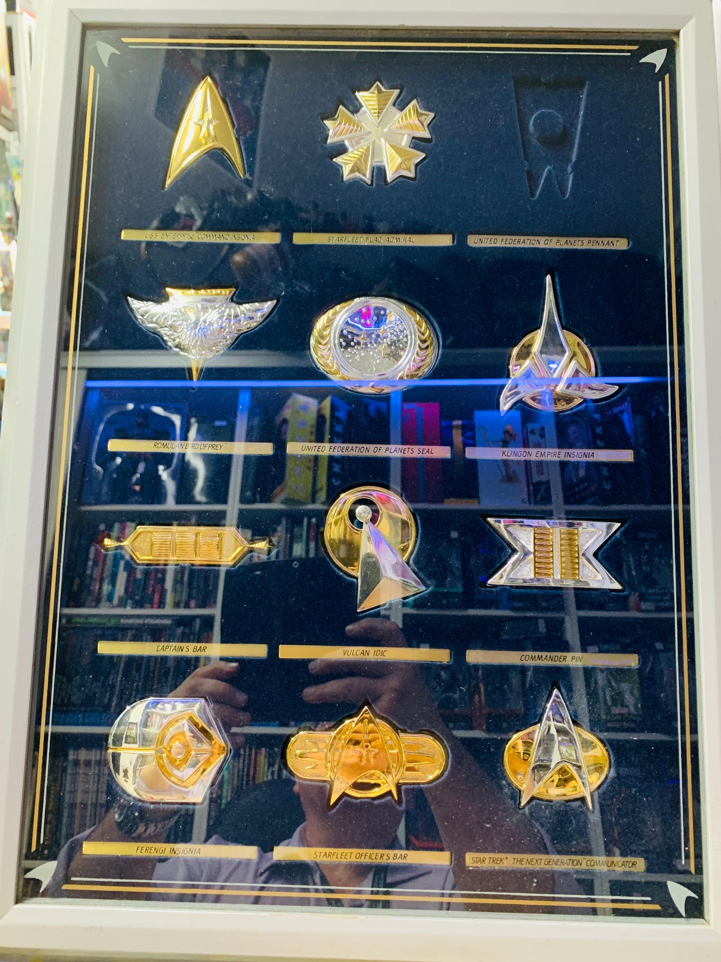 Star Trek Badges one missing in glass case