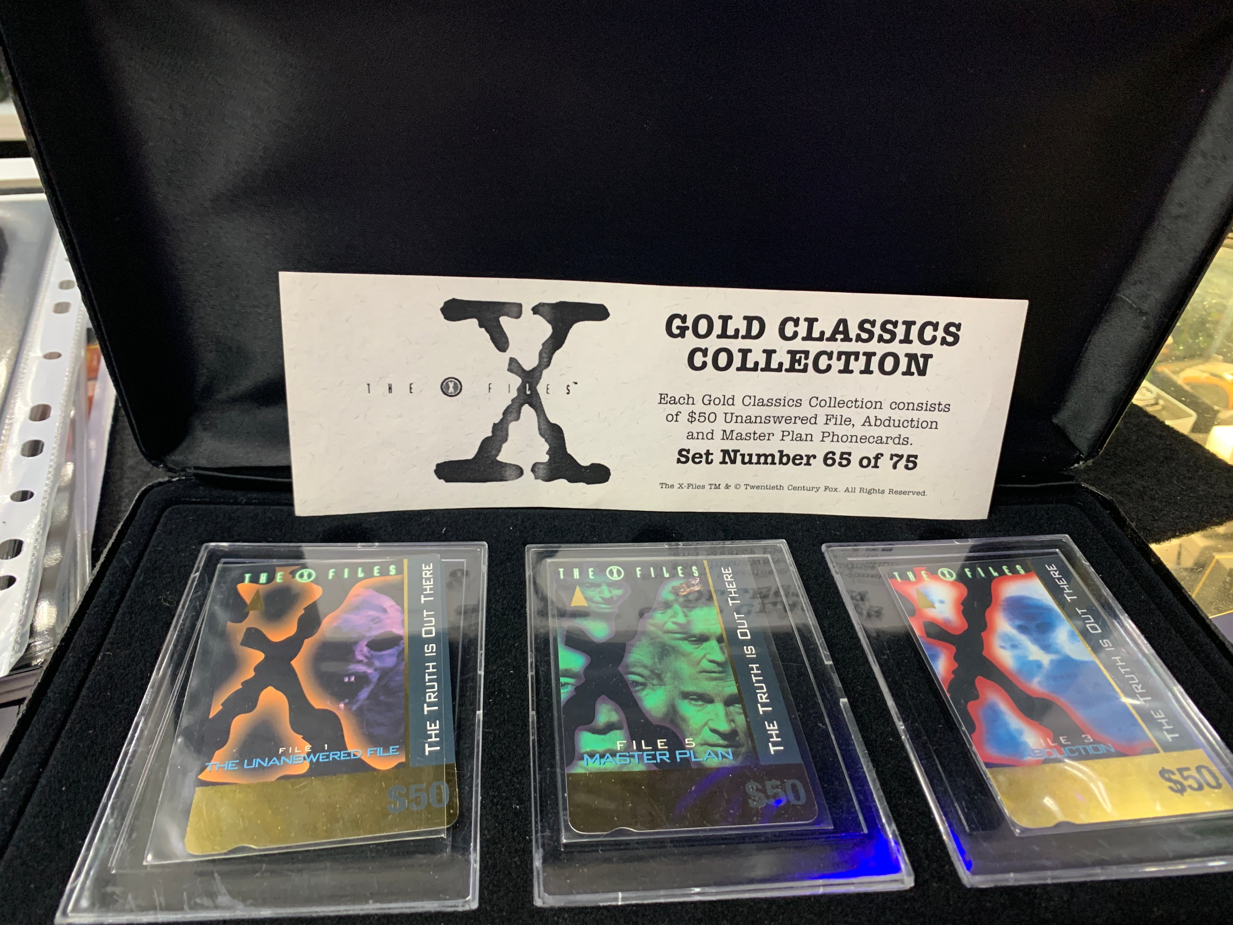 The X Files Gold Classic collection case old and warn phone cards ...