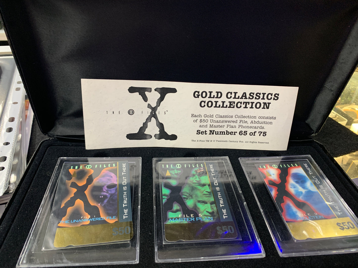 The X Files Gold Classic collection case old and warn phone cards