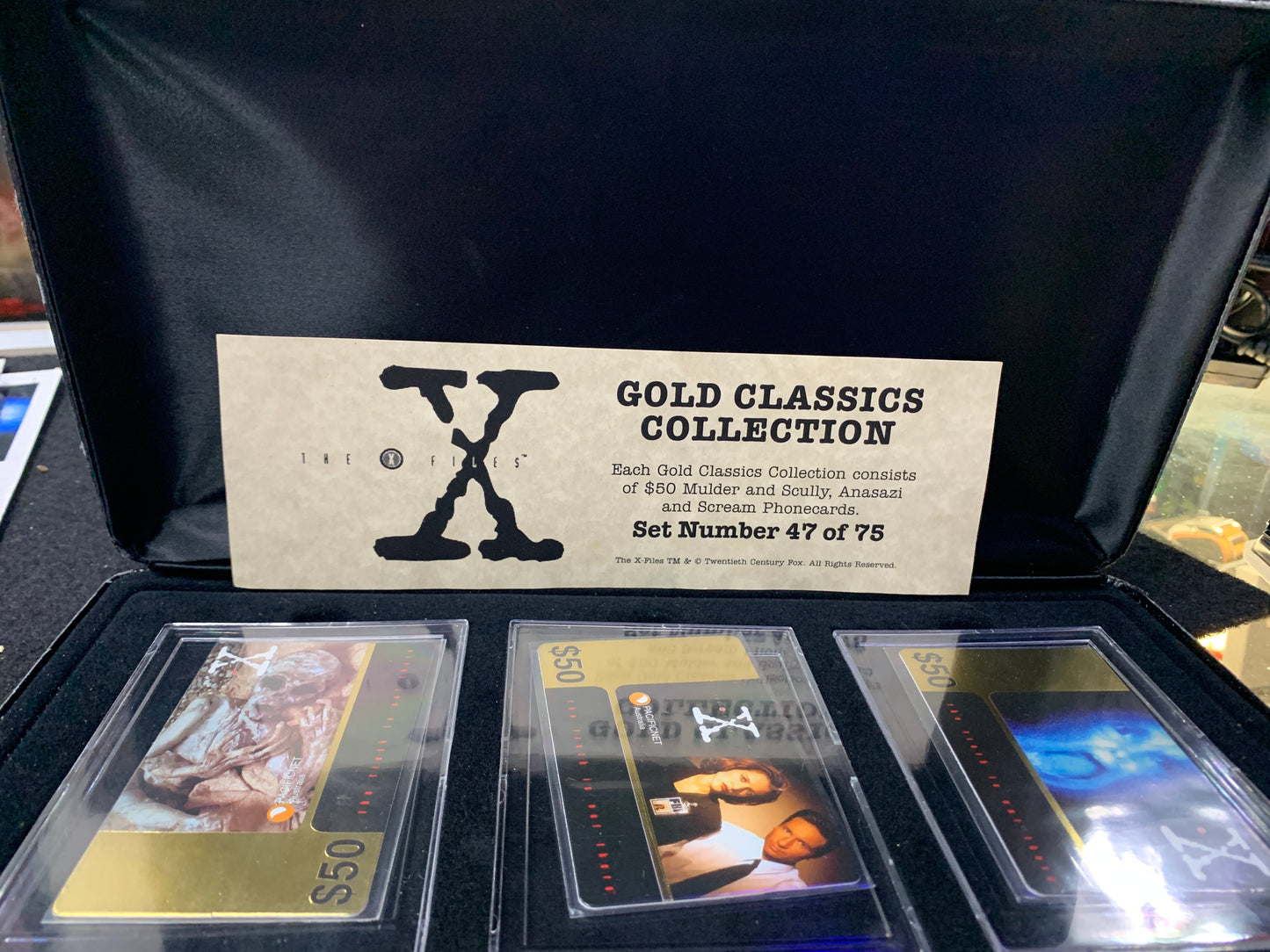 The  XFiles gold classics collection phone cards box is warm